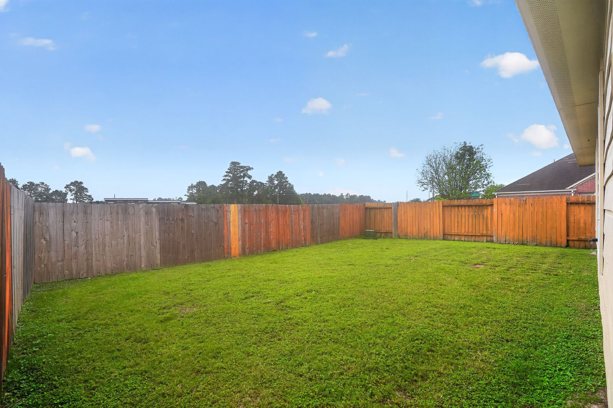 29414 Winton Wood Way Spring, TX 77386 - Photo 34 of 35 a view of a yard with a fence and trees