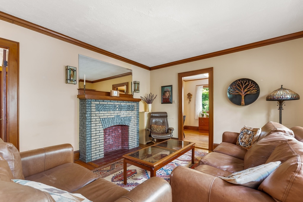 12 Grandview Road Arlington, MA 02476 - Photo 15 of 42 a living room with furniture and a fireplace