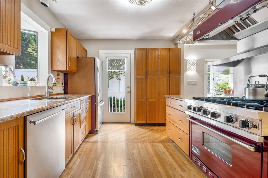 12 Grandview Road Arlington, MA 02476 - Photo 4 of 42 a kitchen with stainless steel appliances granite countertop a stove and a sink