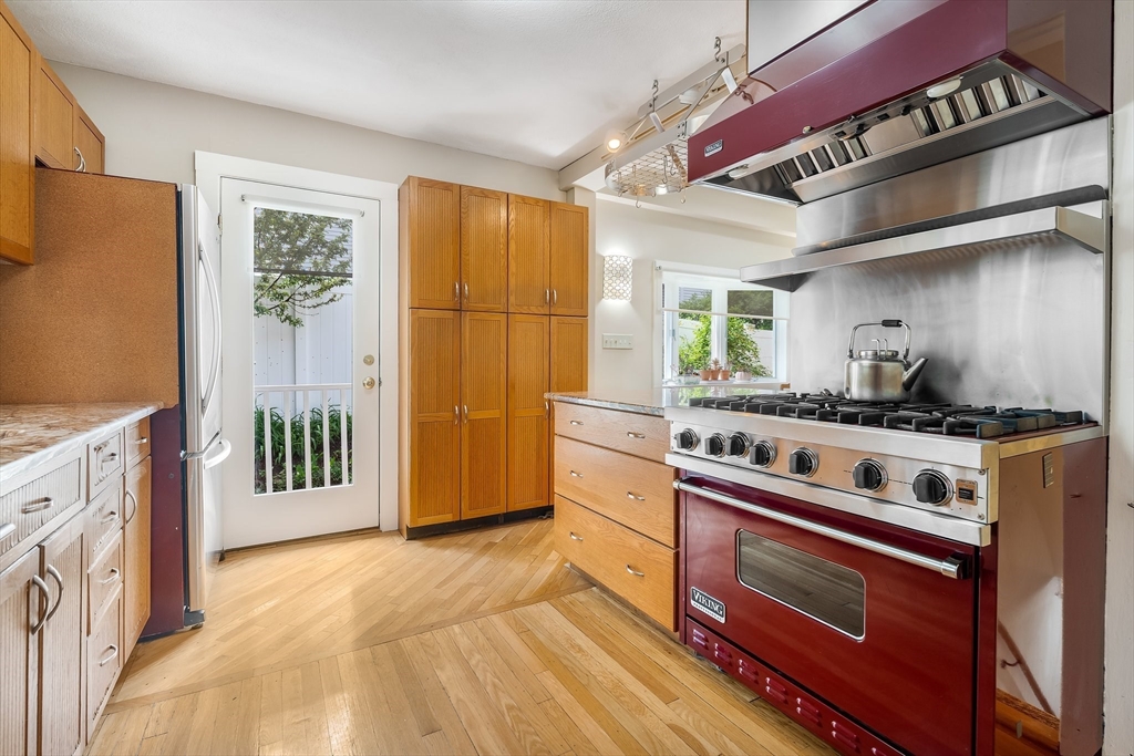 12 Grandview Road Arlington, MA 02476 - Photo 5 of 42 a kitchen with stainless steel appliances granite countertop a stove and a refrigerator