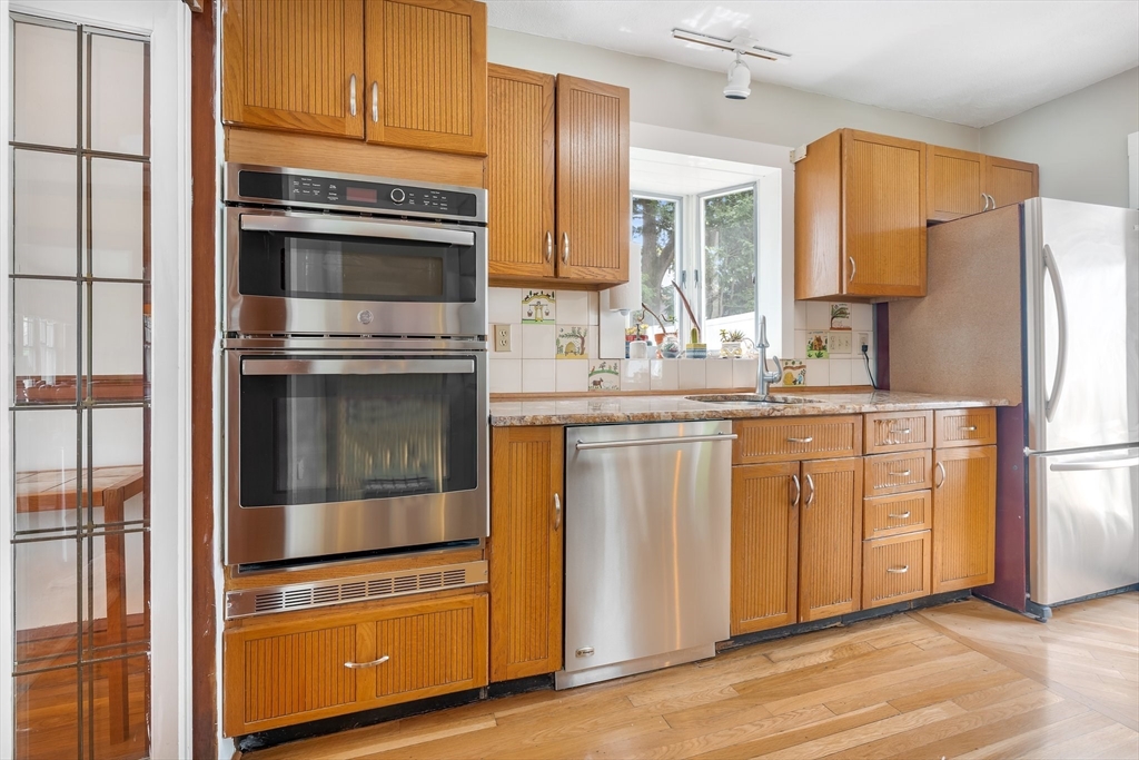 12 Grandview Road Arlington, MA 02476 - Photo 6 of 42 a kitchen with stainless steel appliances a stove sink and refrigerator