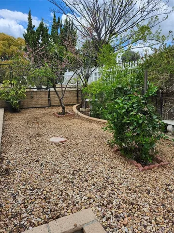 a vase of flowers sitting on a floor