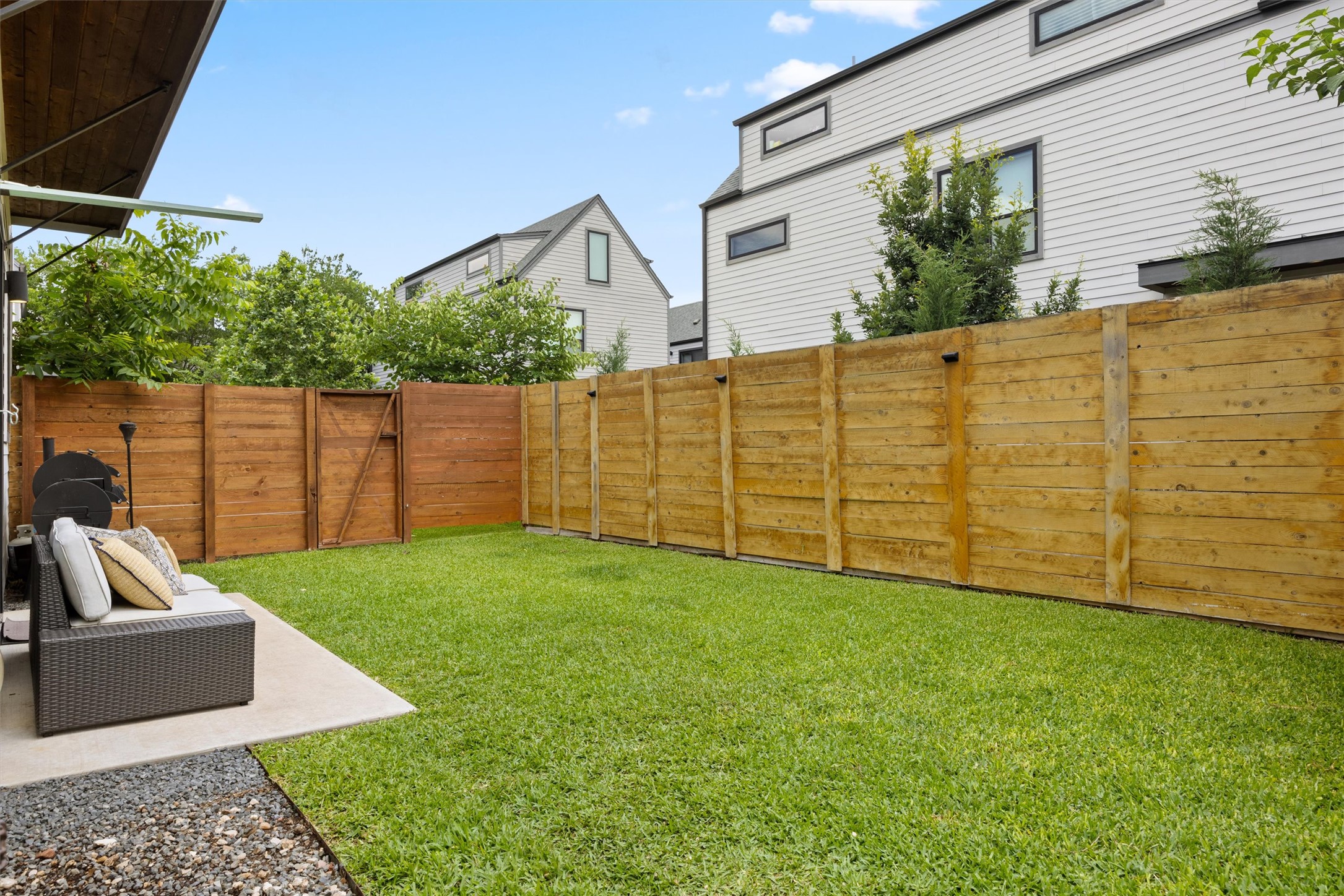 1116 Stobaugh Street, Unit B Austin, TX 78757 - Photo 9 of 38 The fenced backyard offers a private outdoor space that is easy to maintain.