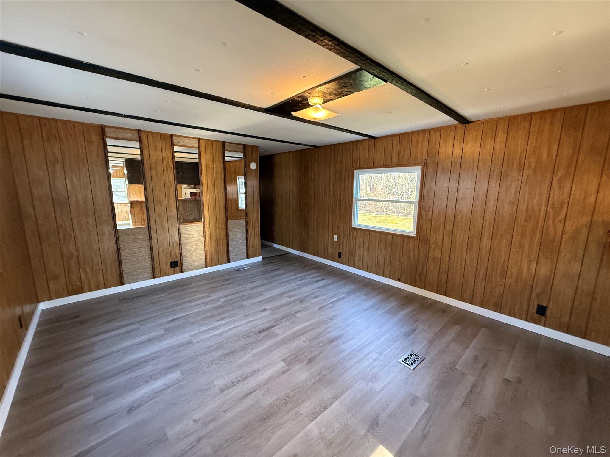 25 Fawn Road, Unit LOT 1 Saugerties, NY 12477 - Photo 11 of 19 an empty room with wooden floor and windows