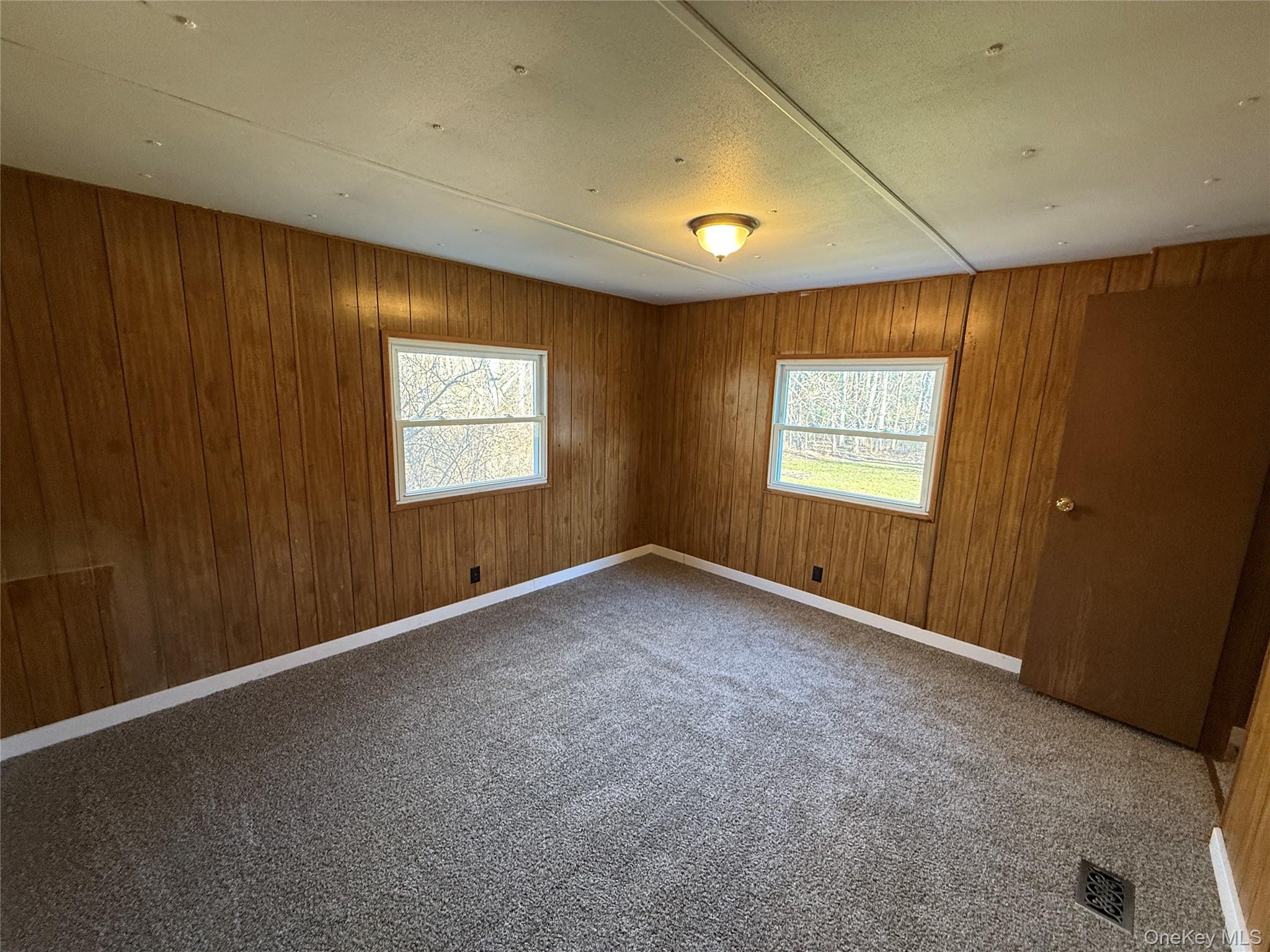 25 Fawn Road, Unit LOT 1 Saugerties, NY 12477 - Photo 12 of 19 an empty room with windows