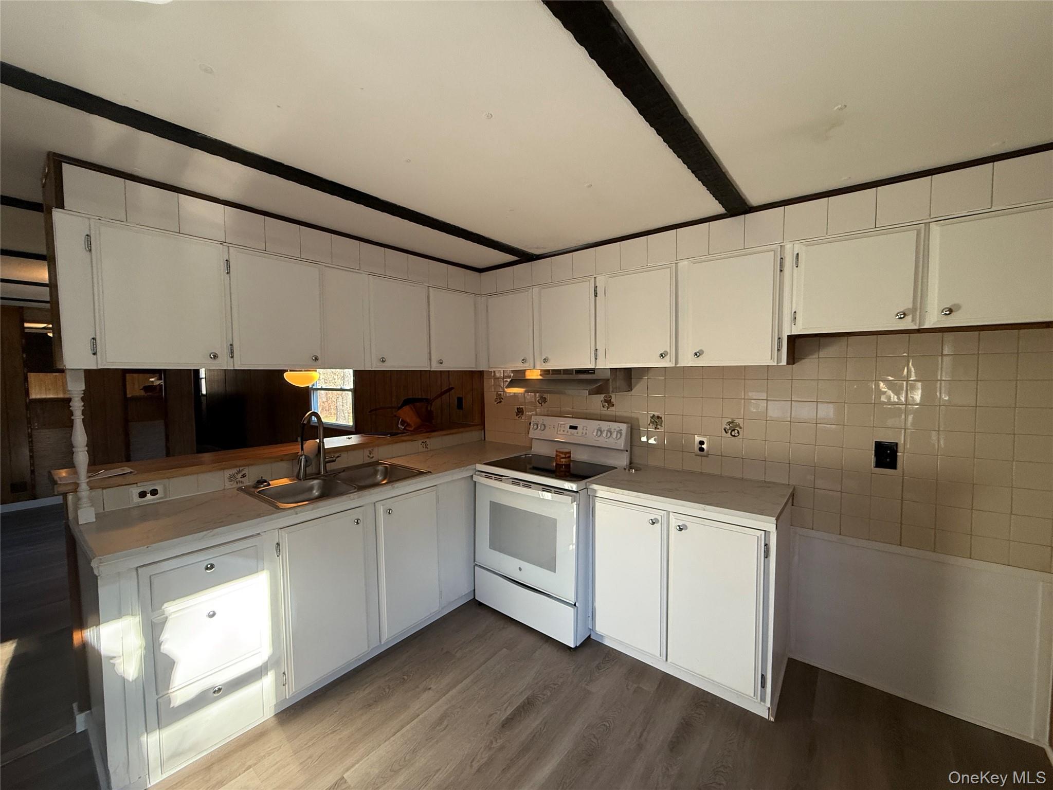 25 Fawn Road, Unit LOT 1 Saugerties, NY 12477 - Photo 4 of 19 a kitchen with stainless steel appliances a sink stove and cabinets