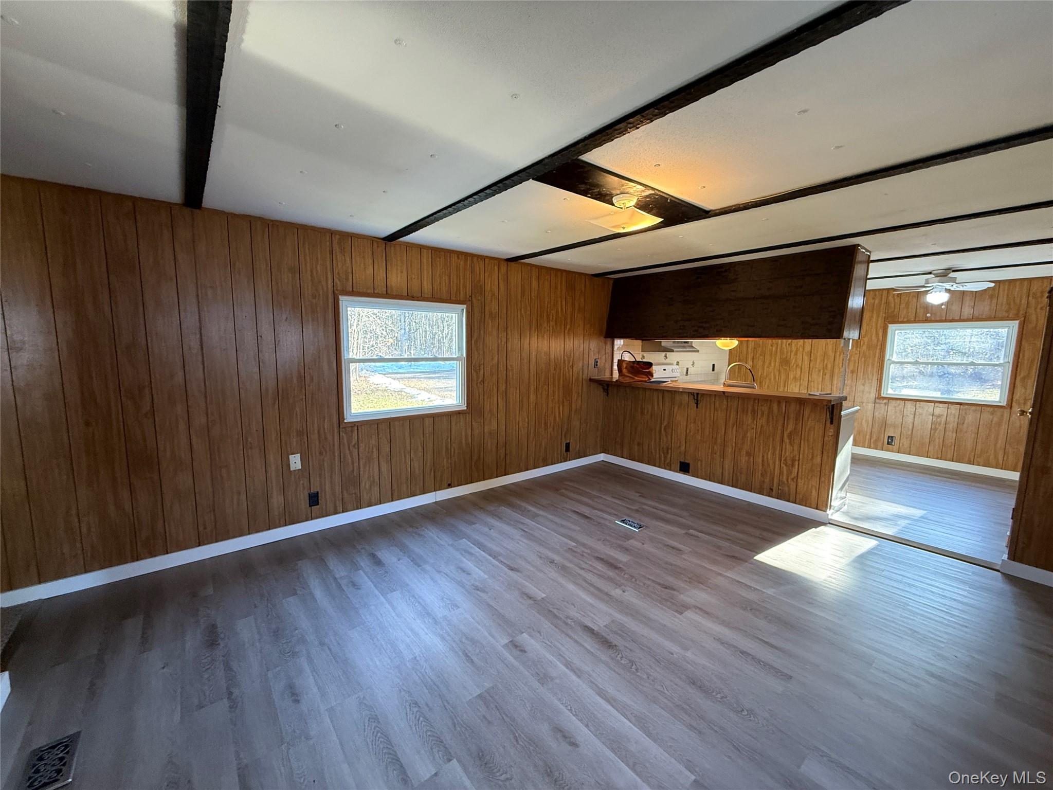 25 Fawn Road, Unit LOT 1 Saugerties, NY 12477 - Photo 7 of 19 an empty room with wooden floor and windows