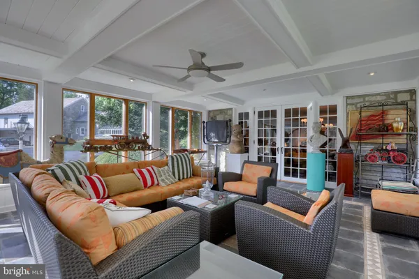 a dining room with furniture and window