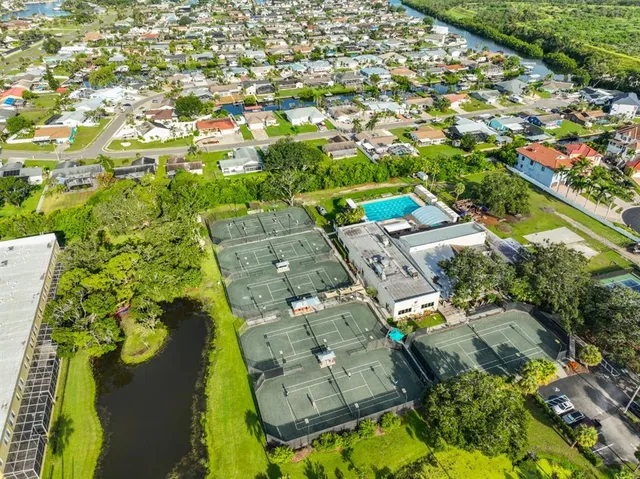 an aerial view of a house with a lake view