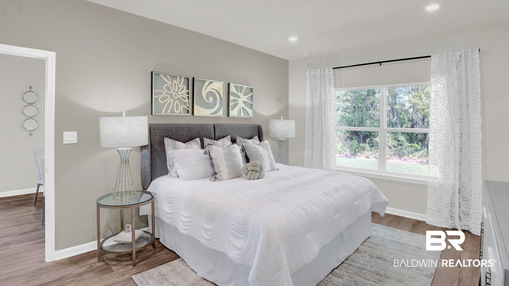 13330 Shea Circle Foley, AL 36535 - Photo 11 of 15 Spacious room featuring wood-finish flooring, a large window with white trim, and recessed lighting