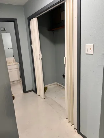 a view of a kitchen from a hallway