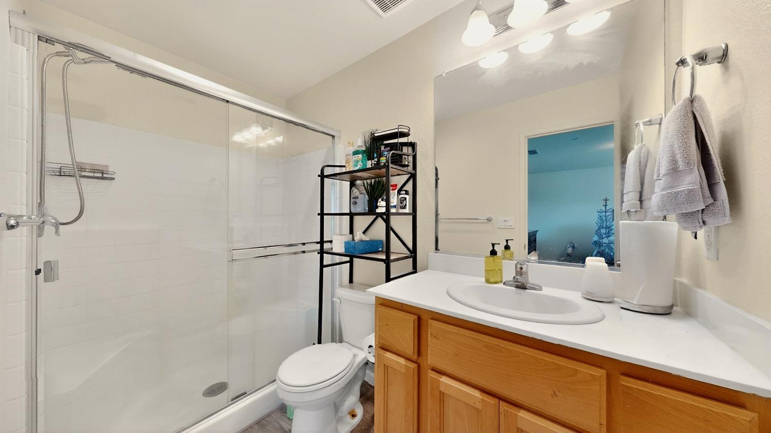 753 Taryn Court Merced, CA 95341 - Photo 11 of 21 a bathroom with a sink a toilet and shower