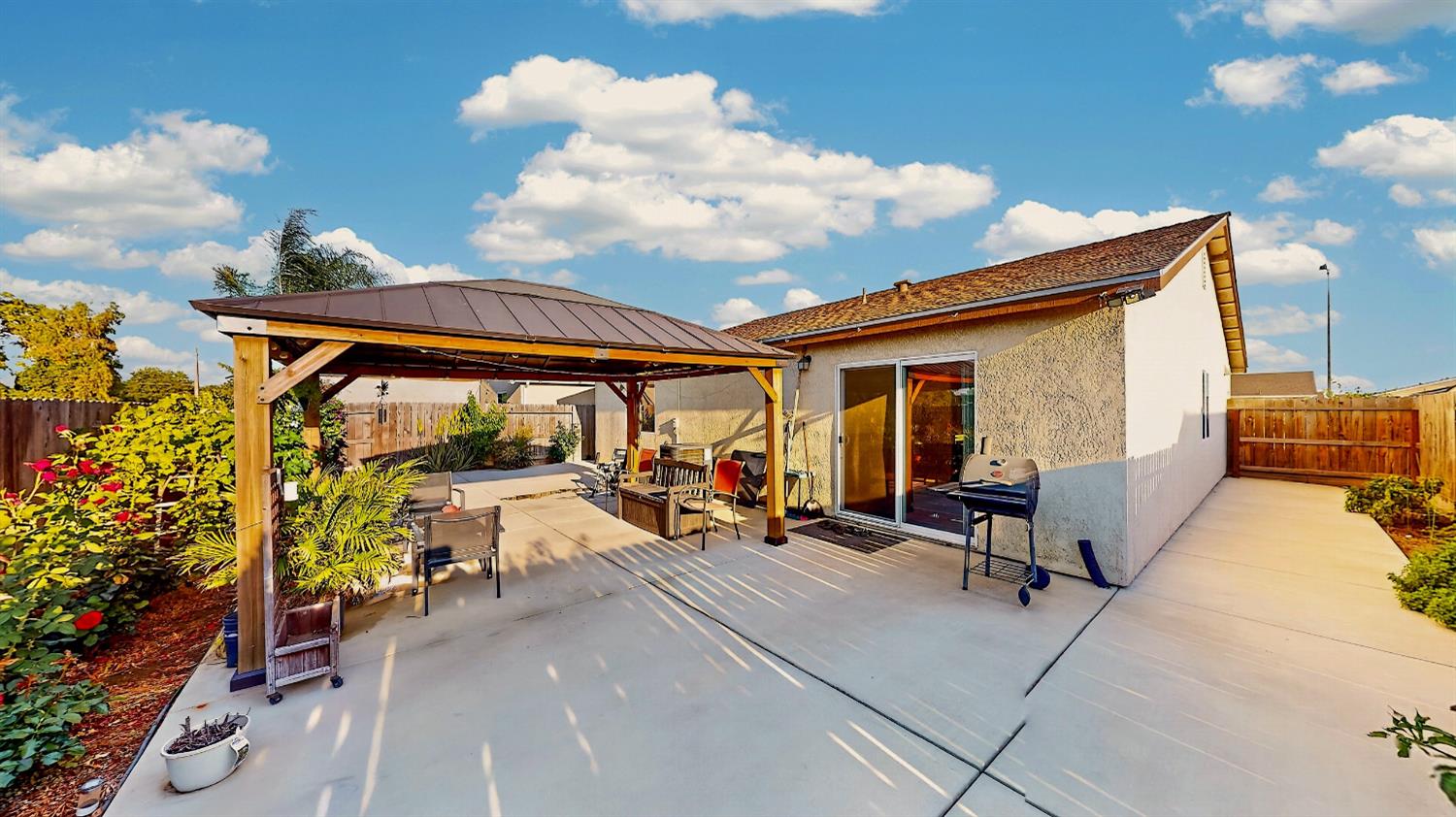 753 Taryn Court Merced, CA 95341 - Photo 14 of 21 a view of a patio with table and chairs and potted plants