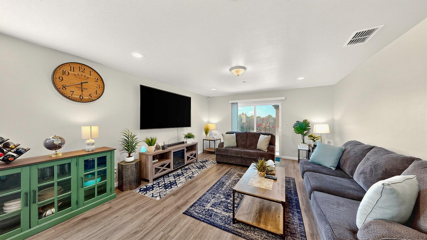 753 Taryn Court Merced, CA 95341 - Photo 2 of 21 a living room with furniture and a flat screen tv