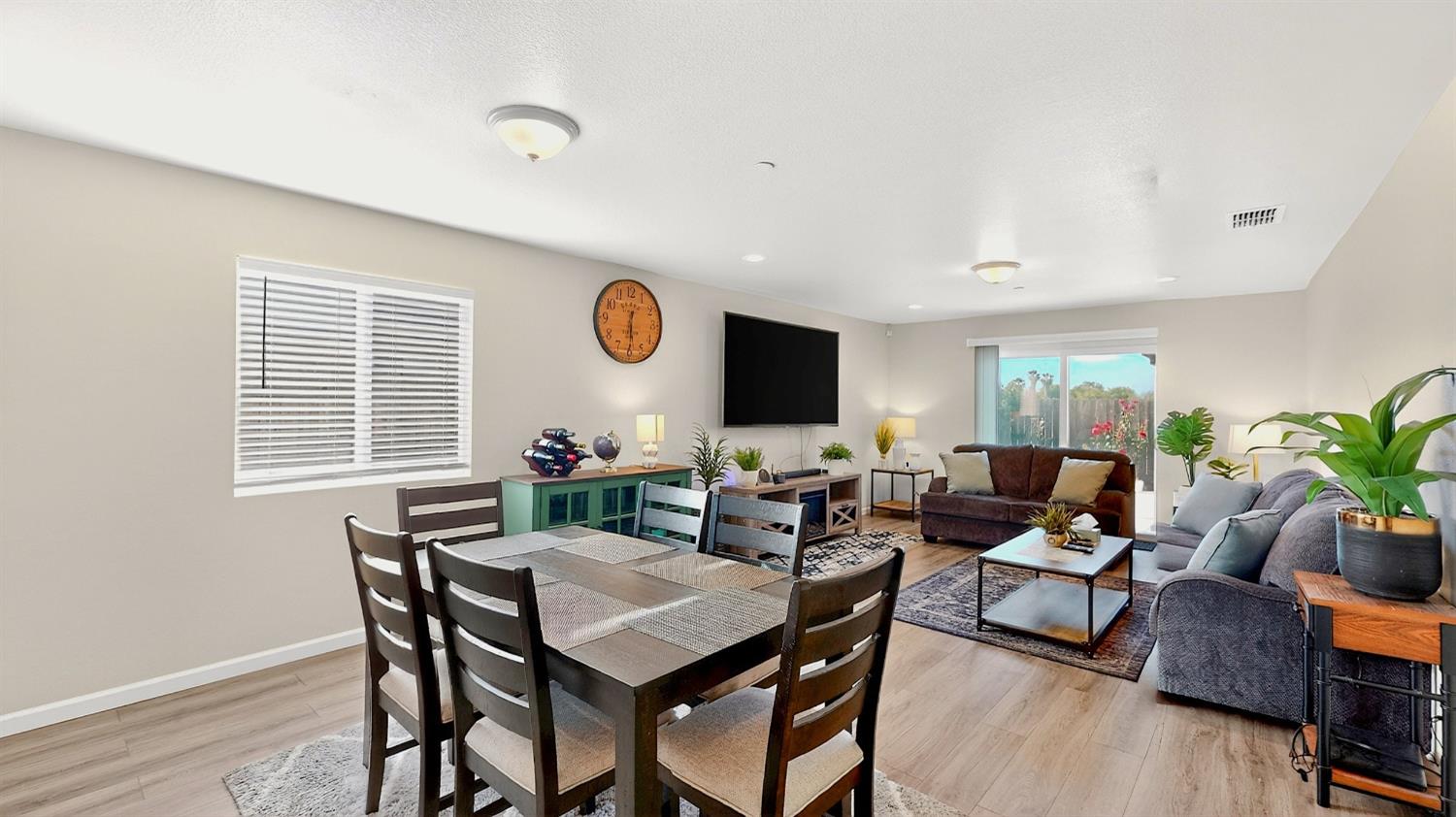 753 Taryn Court Merced, CA 95341 - Photo 3 of 21 a view of a dining room with furniture and wooden floor