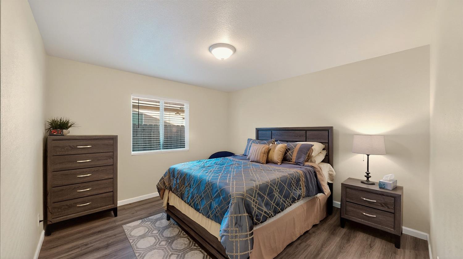 753 Taryn Court Merced, CA 95341 - Photo 8 of 21 a bedroom with a bed and a window