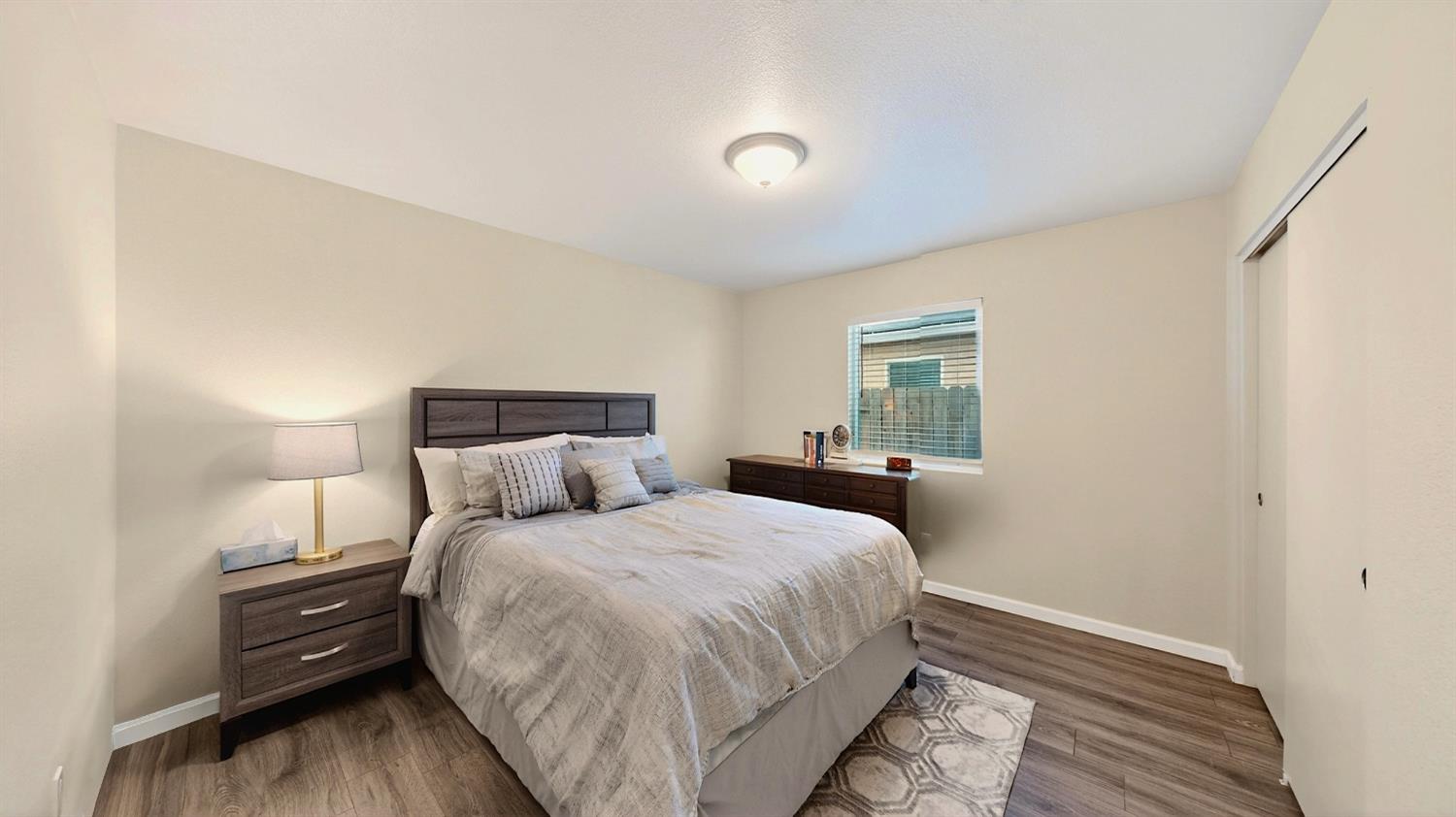 753 Taryn Court Merced, CA 95341 - Photo 9 of 21 a bedroom with a bed and a night stand