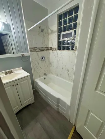 a bathroom with a bathtub sink and toilet