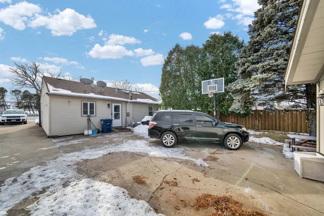a car parked in front of a house