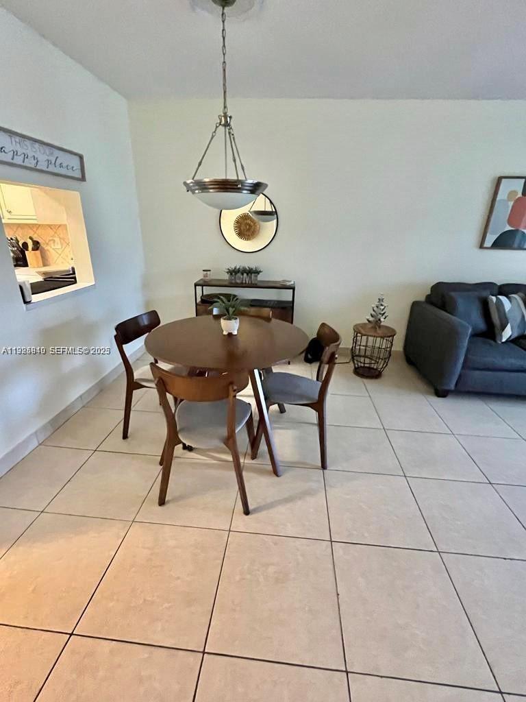 5961 Northwest 61st Avenue, Unit 208 Tamarac, FL 33319 - Photo 5 of 11 a view of a workspace with furniture