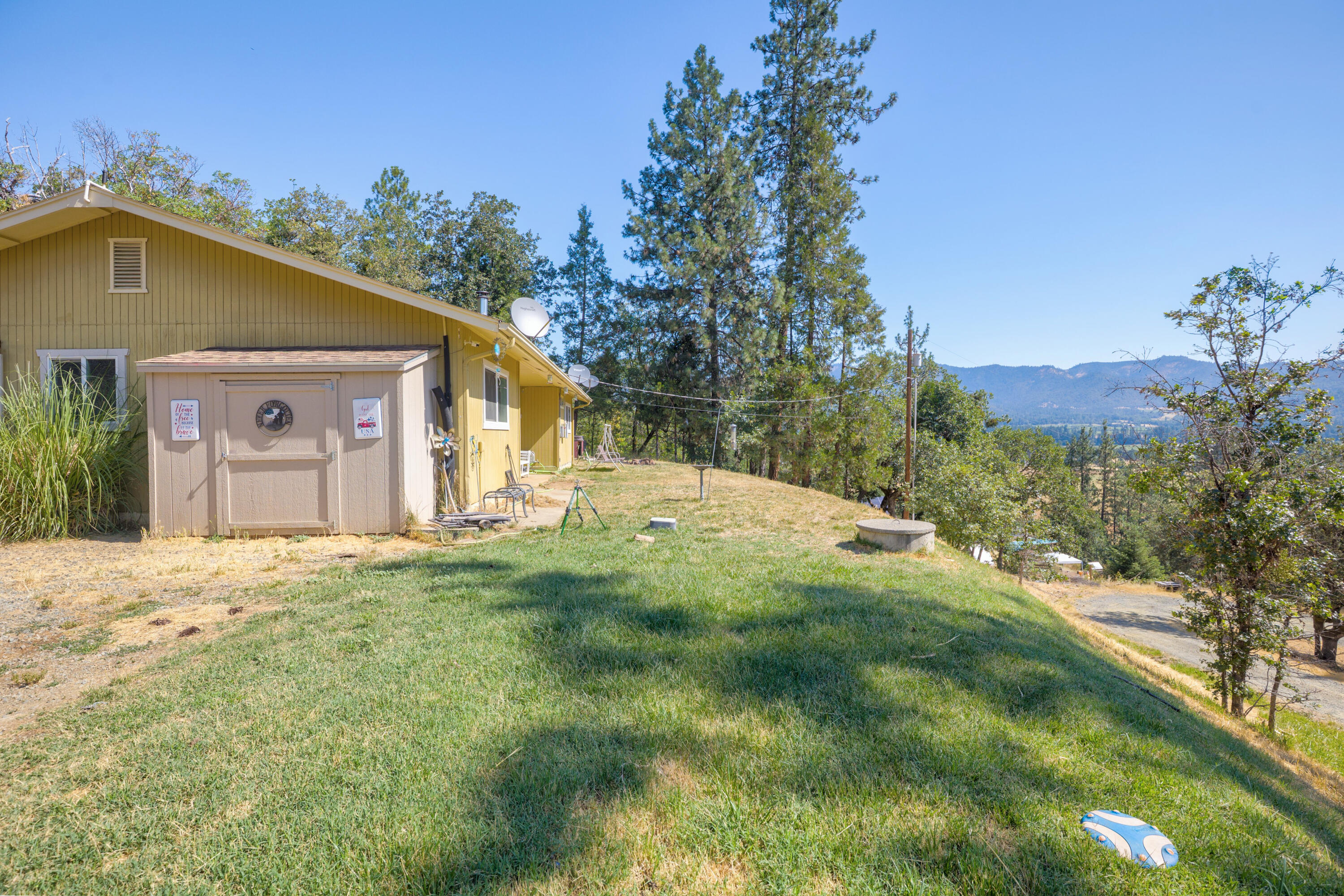 12748 Water Gap Road Williams, OR 97544 - Photo 1 of 35 a view of a house with a yard