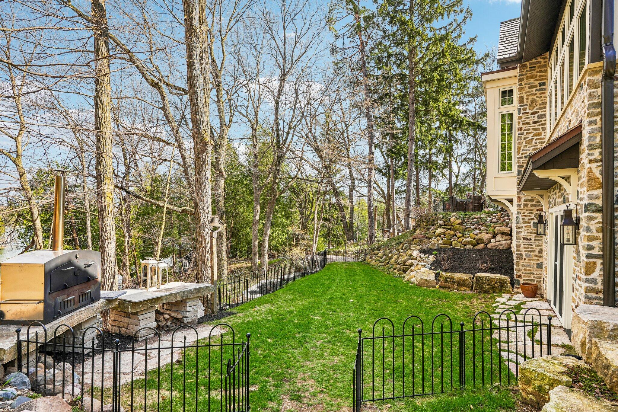 N7329 County Road CJ Rhine, WI 53073 - Photo 69 of 120 Pizza oven grassy courtyard