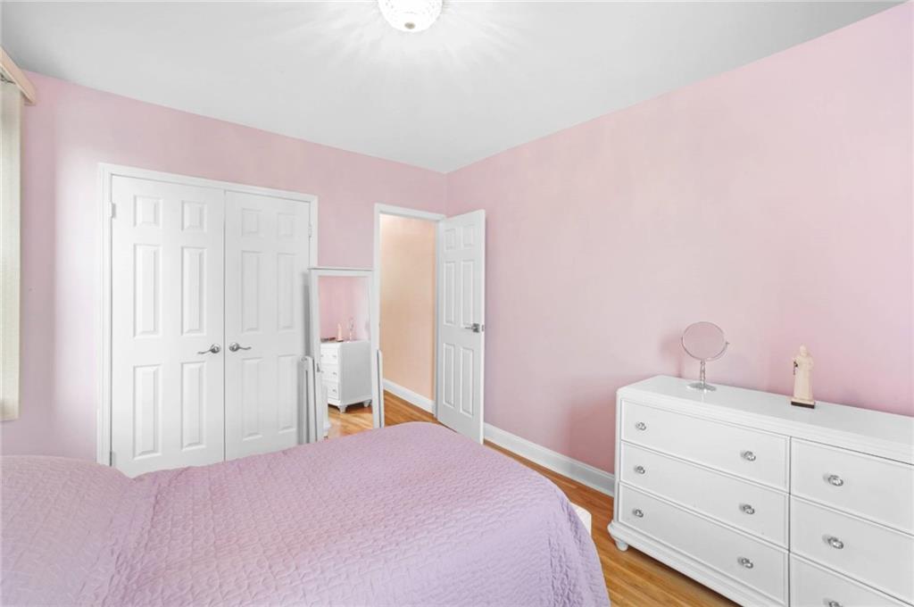 2310 Ocean Parkway, Unit 3J Brooklyn, NY 11223 - Photo 8 of 8 a bedroom with a bed and a dresser