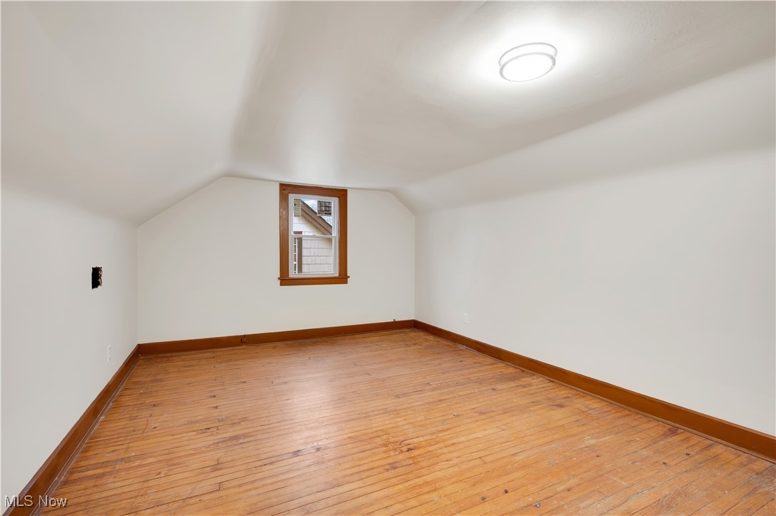 2016 Rossmoor Road Cleveland Heights, OH 44118 - Photo 37 of 46 Additional living space with light wood-style floors and lofted ceiling