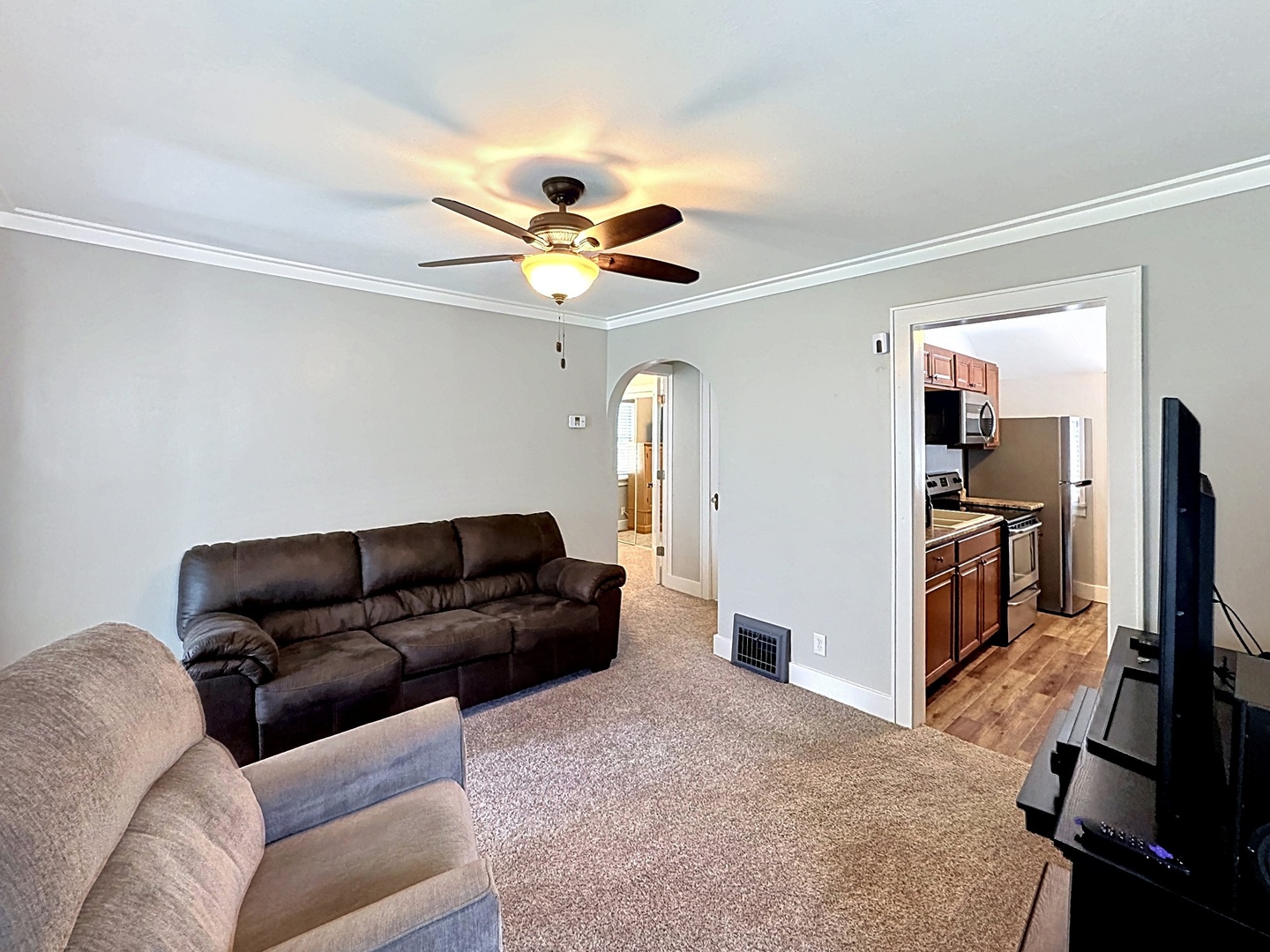 1841 32nd Street Moline, IL 61265 - Photo 4 of 24 a living room with furniture and a flat screen tv
