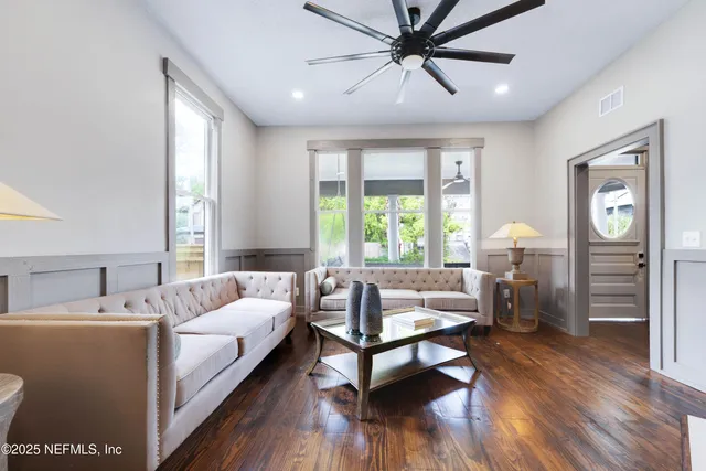 a living room with furniture and a window