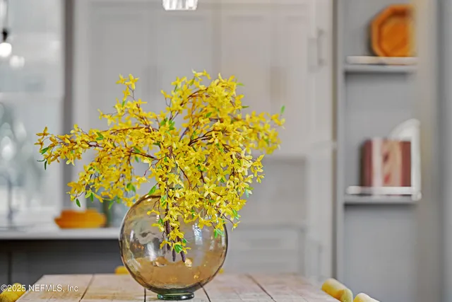 a view of a vase of flowers sitting on a table