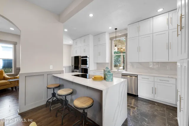 a kitchen that has a cabinets counter space and appliances