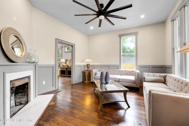 a living room with furniture and a fireplace