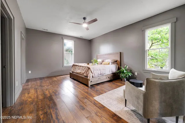 a living room with furniture and windows