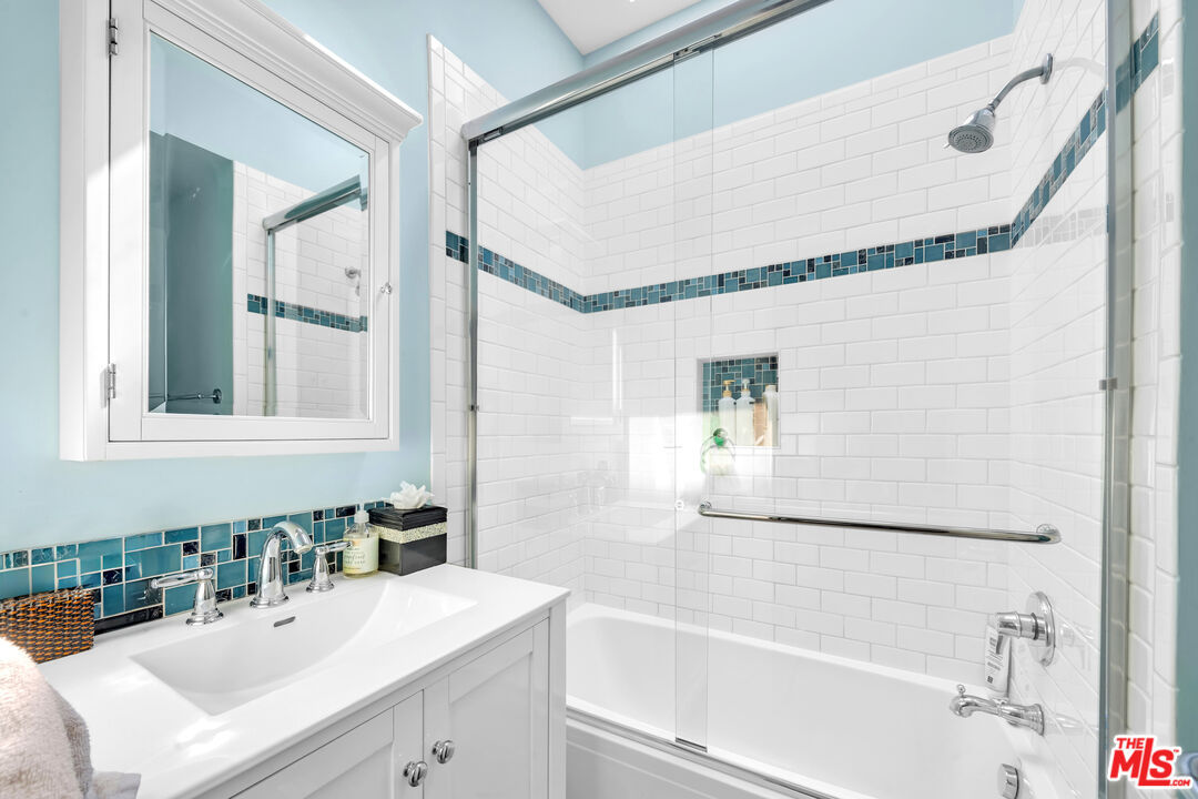 25444 Malibu Road Malibu, CA 90265 - Photo 15 of 15 a bathroom with a sink and a mirror