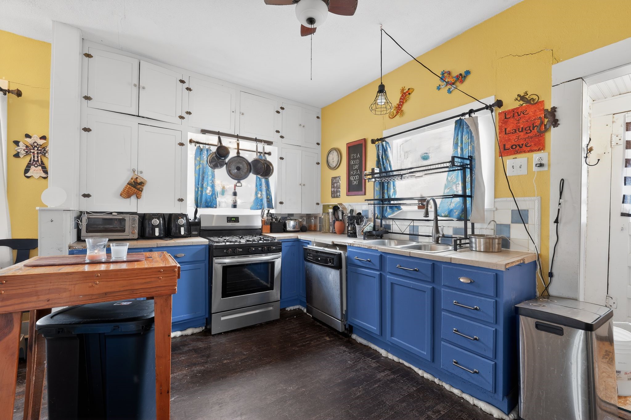 1017 North 11th Street Temple, TX 76501 - Photo 11 of 25 a kitchen with stainless steel appliances granite countertop a sink and cabinets