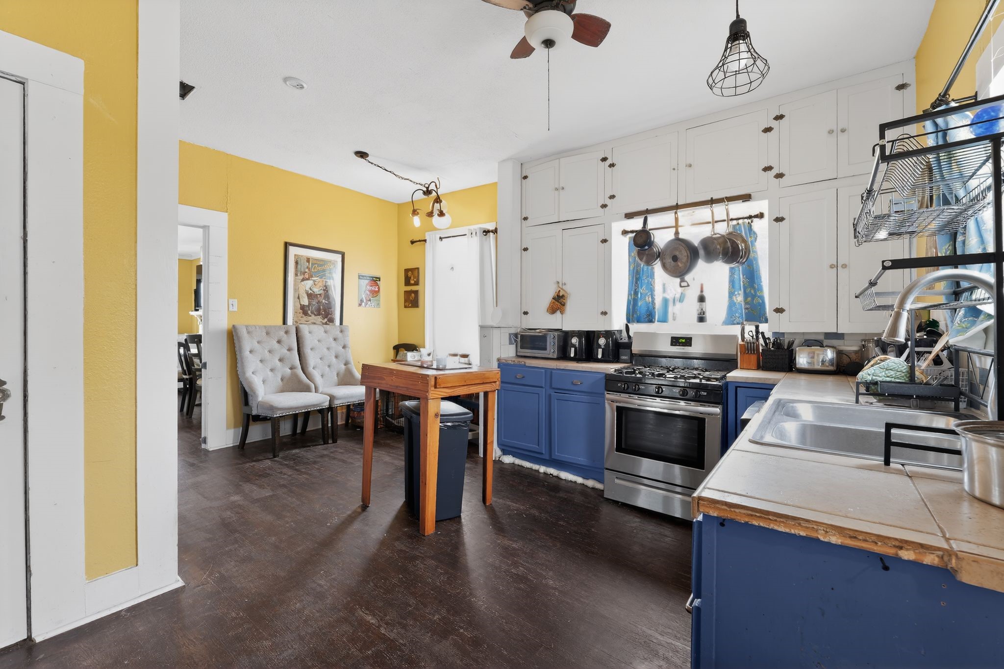 1017 North 11th Street Temple, TX 76501 - Photo 13 of 25 a living room with lots of furniture and kitchen view