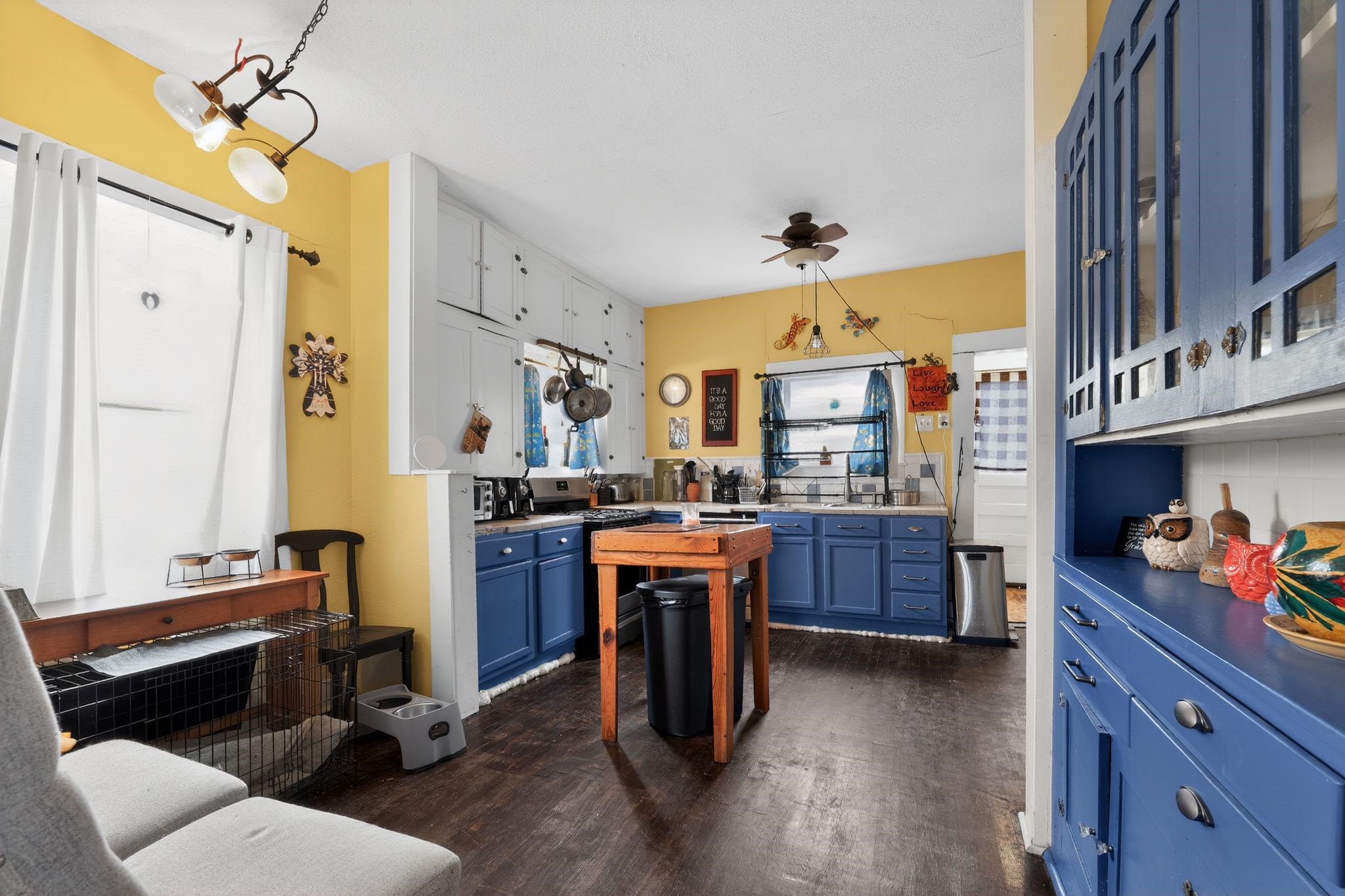 1017 North 11th Street Temple, TX 76501 - Photo 14 of 25 a kitchen with kitchen island a counter top space a sink stainless steel appliances and cabinets