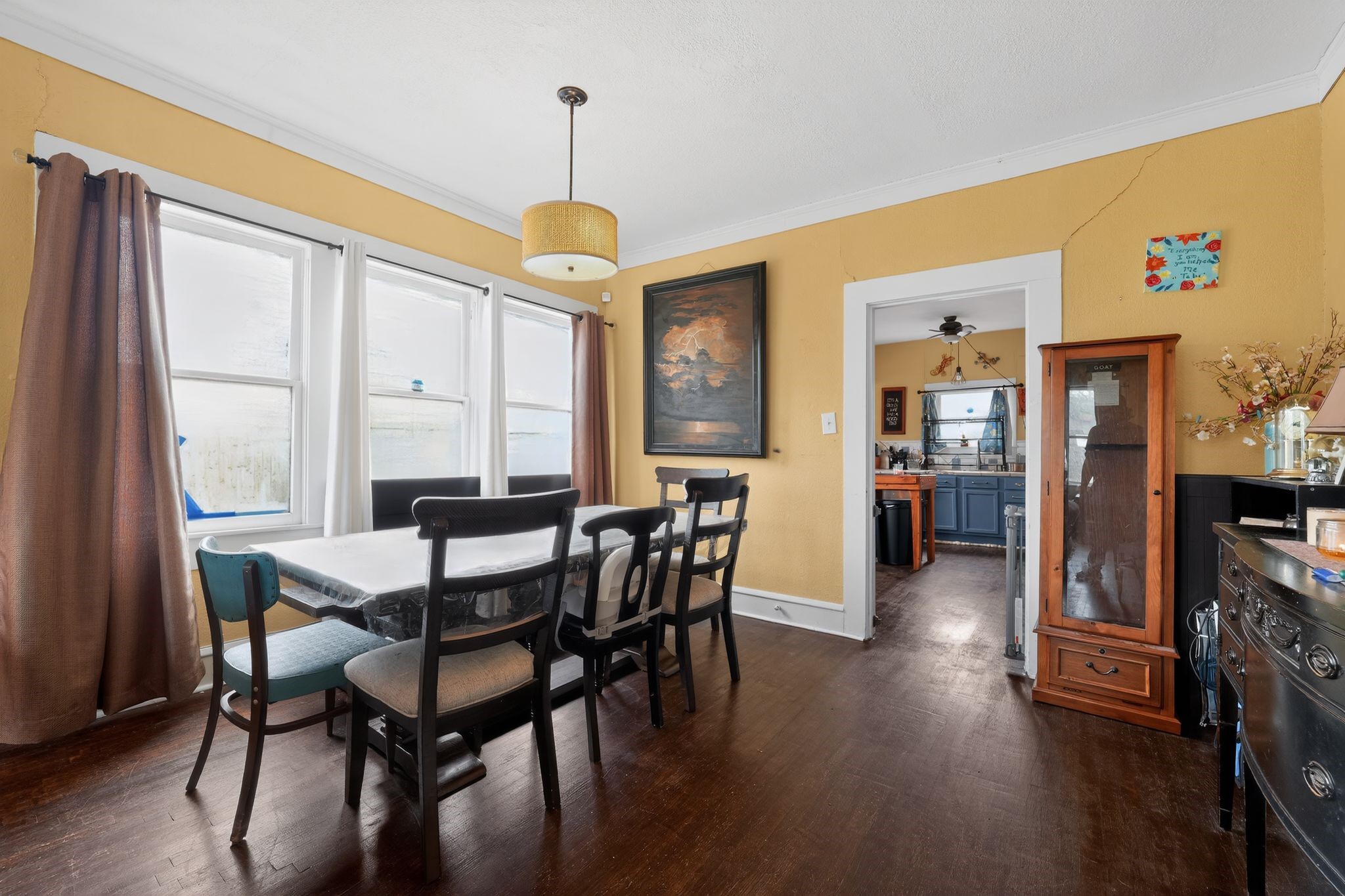 1017 North 11th Street Temple, TX 76501 - Photo 15 of 25 a view of a dining room with furniture window and wooden floor