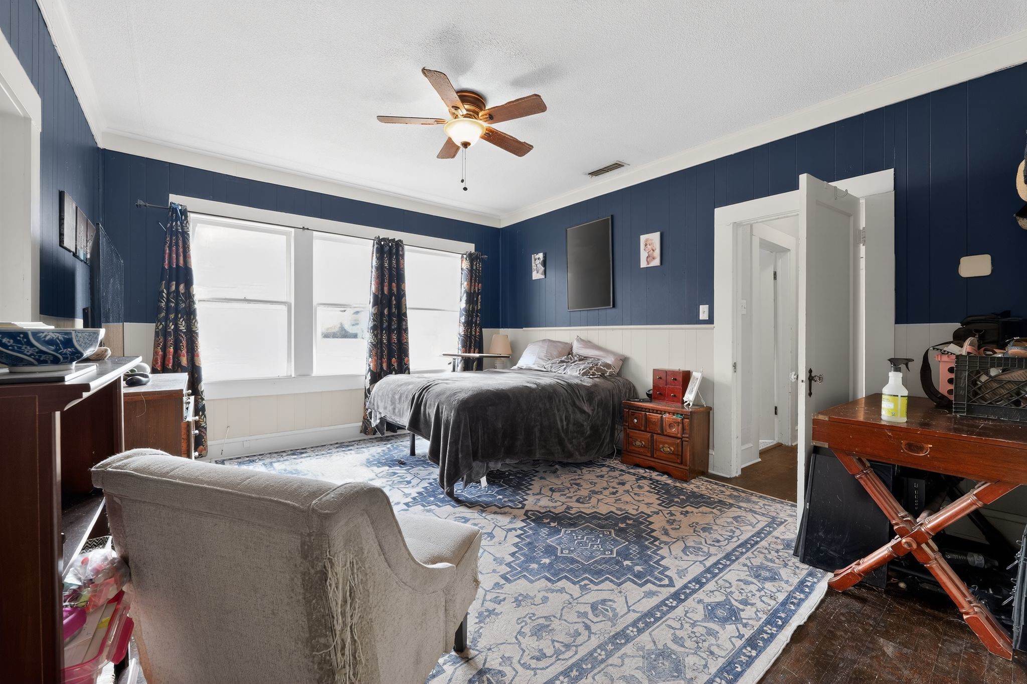 1017 North 11th Street Temple, TX 76501 - Photo 18 of 25 a bedroom with a bed and wooden floor