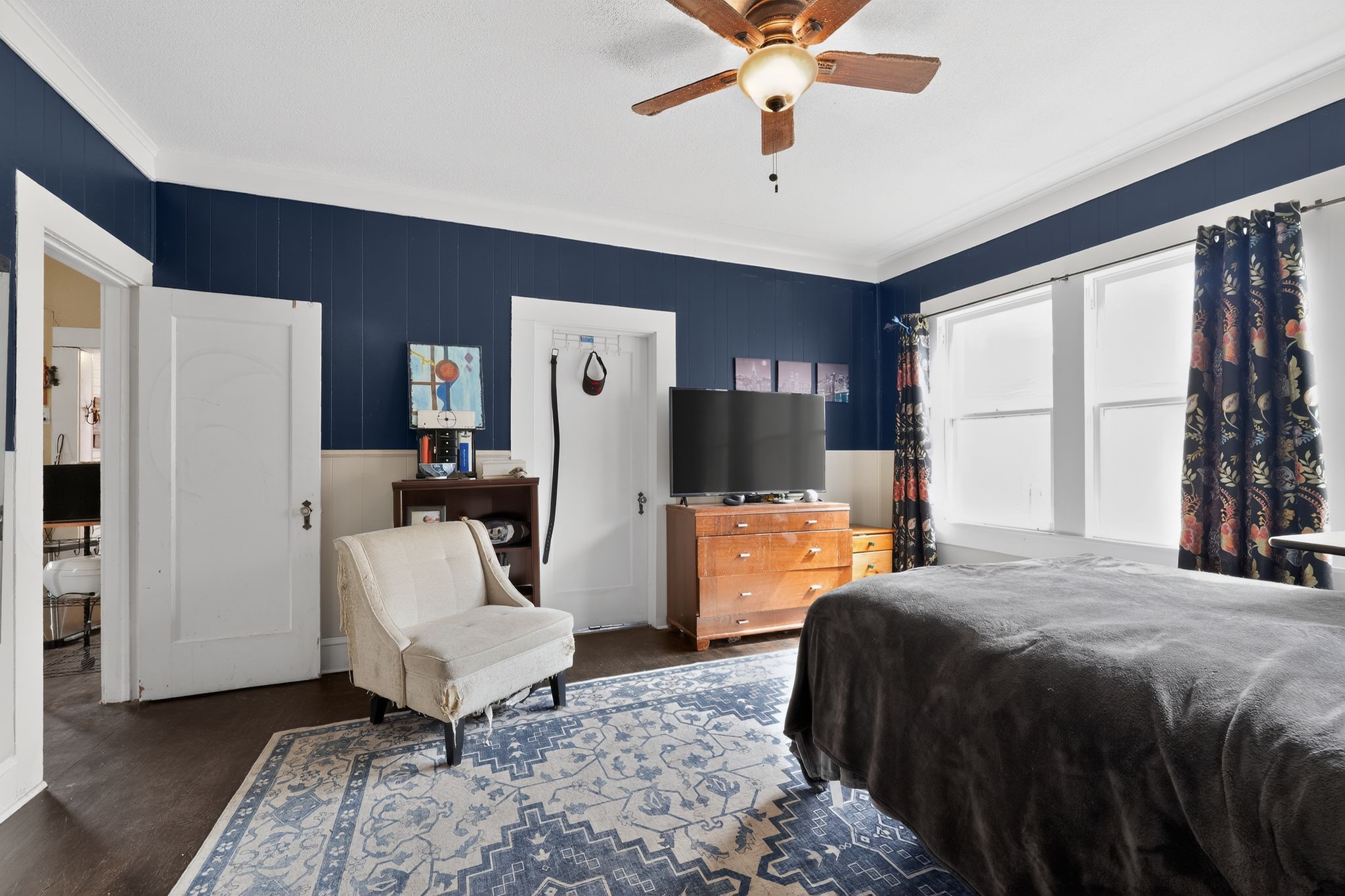 1017 North 11th Street Temple, TX 76501 - Photo 20 of 25 a bedroom with a bed a large window and couch