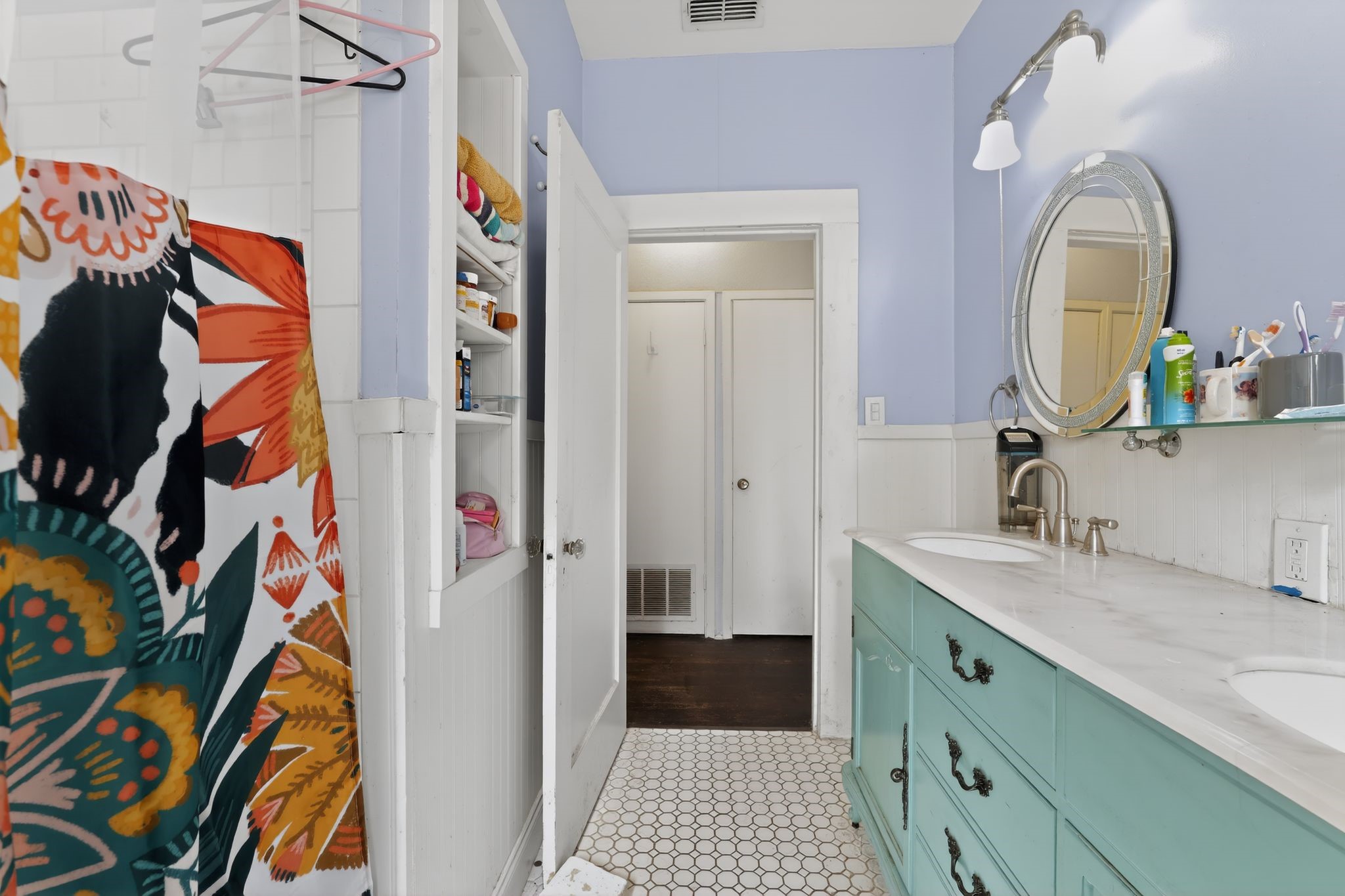 1017 North 11th Street Temple, TX 76501 - Photo 21 of 25 a bathroom with a sink and a mirror