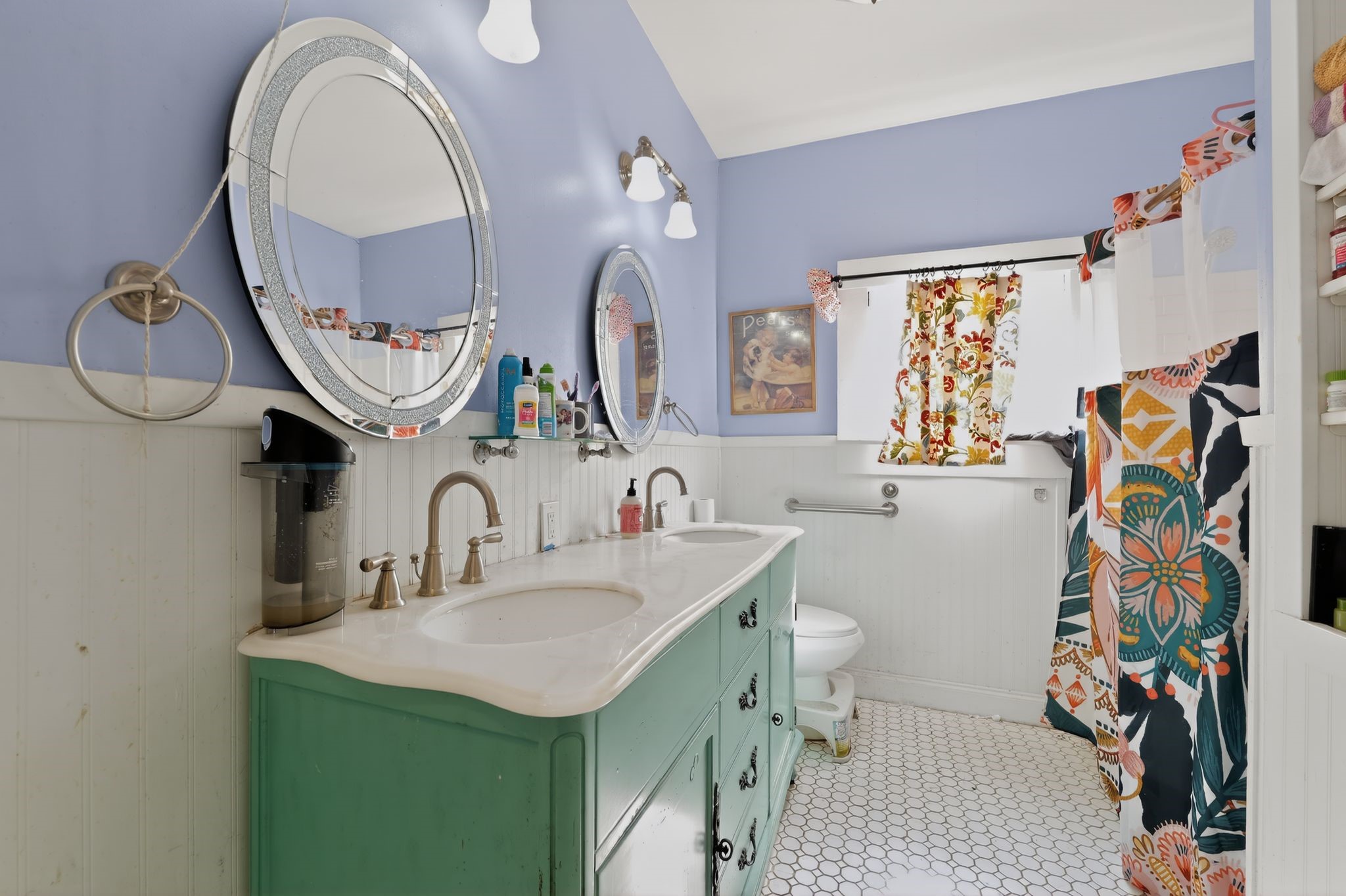 1017 North 11th Street Temple, TX 76501 - Photo 22 of 25 a bathroom with a sink mirror and toilet