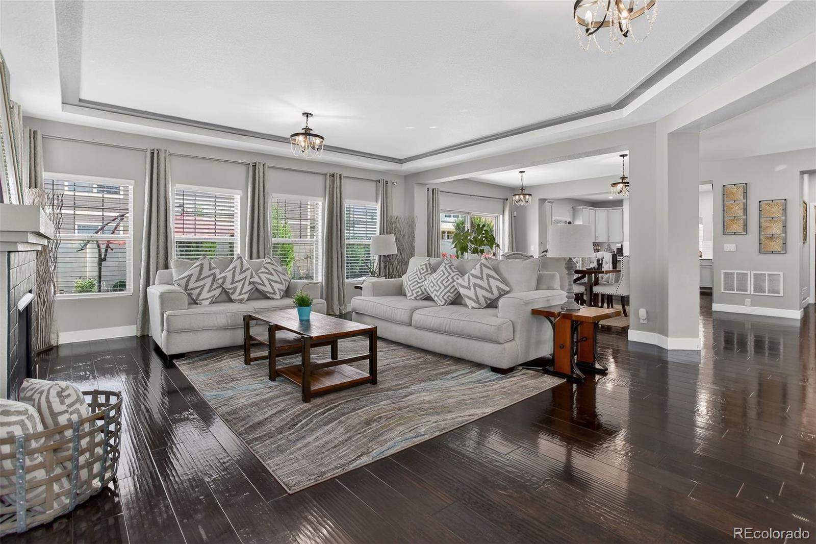 5012 Liverpool Street Denver, CO 80249 - Photo 16 of 49 a living room with furniture and a large window