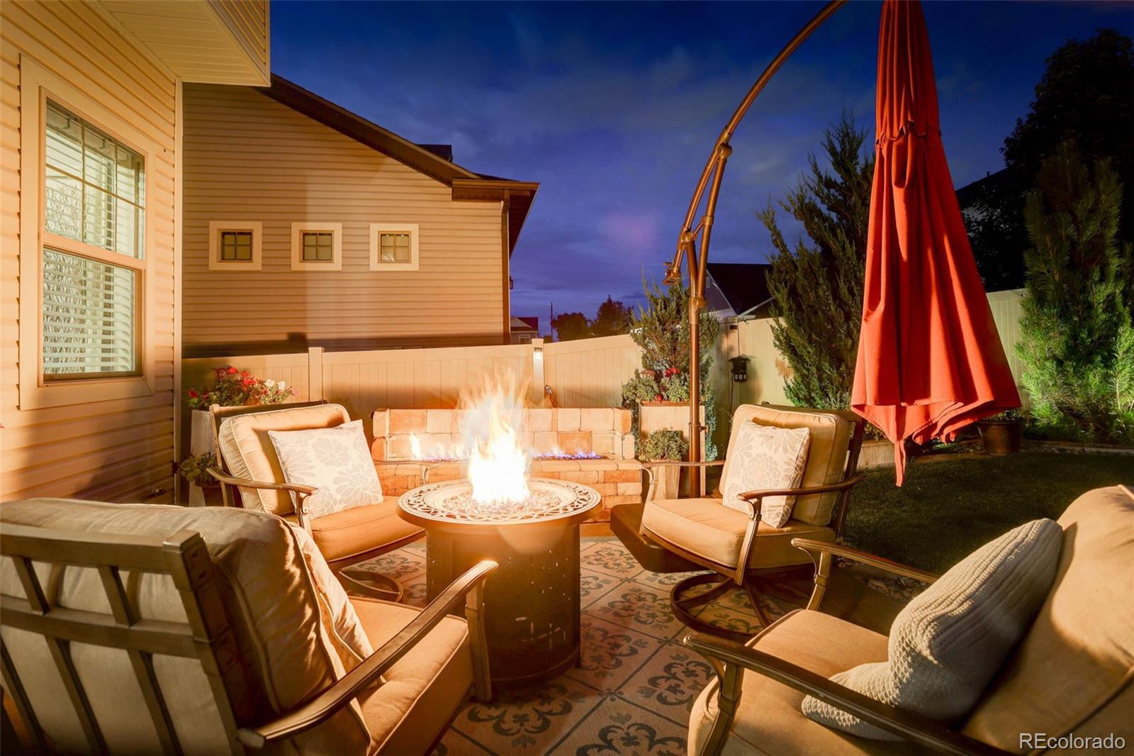 5012 Liverpool Street Denver, CO 80249 - Photo 44 of 49 a view of a chairs and table in a patio