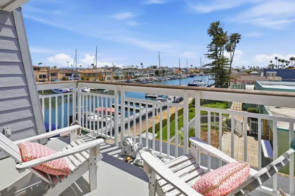 a view of a balcony with wooden floor