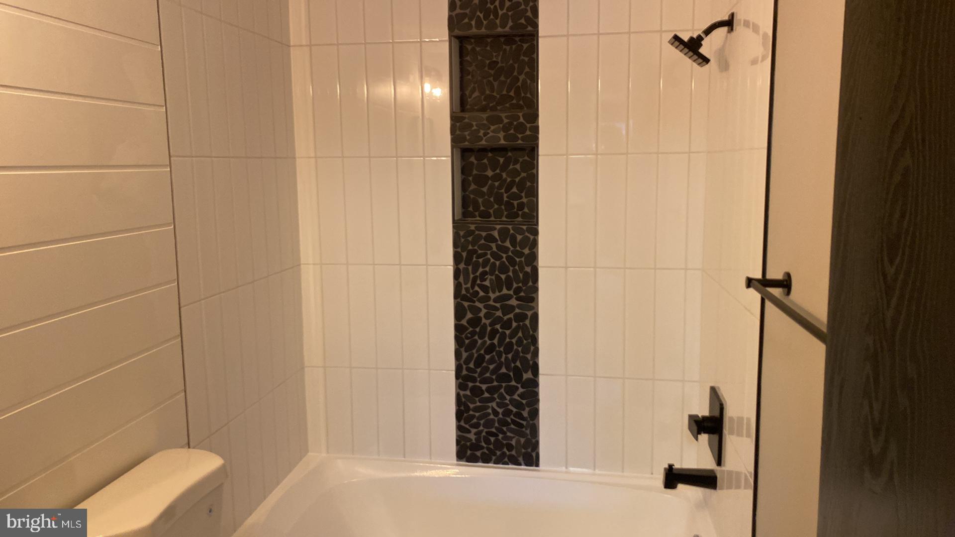 427 Heather Ridge Drive Frederick, MD 21702 - Photo 12 of 17 a bathroom with a bathtub and shower