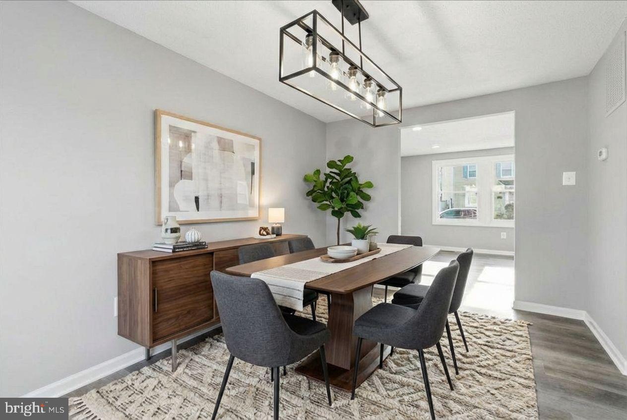 427 Heather Ridge Drive Frederick, MD 21702 - Photo 3 of 18 a view of a dining room with furniture and wooden floor