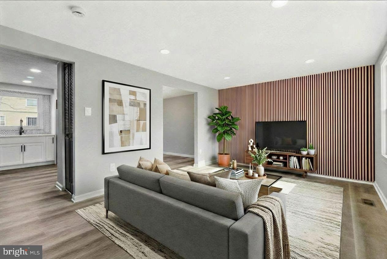 427 Heather Ridge Drive Frederick, MD 21702 - Photo 4 of 18 a living room with furniture and a flat screen tv