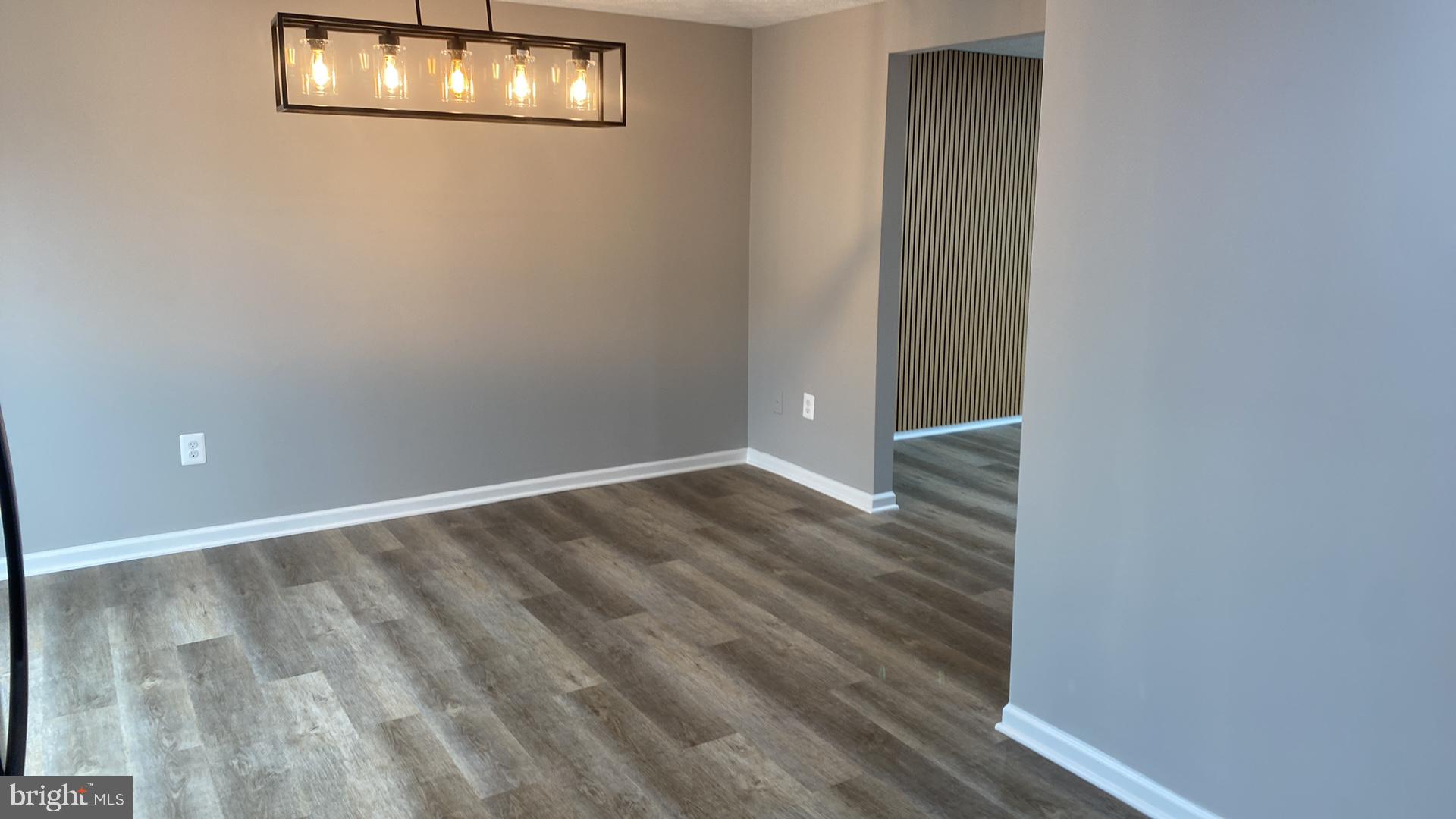 427 Heather Ridge Drive Frederick, MD 21702 - Photo 9 of 17 a view of empty room with wooden floor
